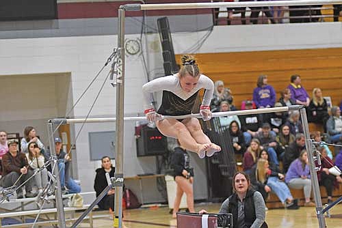 Miah Newport goes through her bars routine at a WIAA Division 2 sectional meet Friday, Feb. 23 at Sheldon Fieldhouse in Antigo. Newport scored a 5.475 in the final meet of her career. (Photo by Brett LaBore/Lakeland Times)