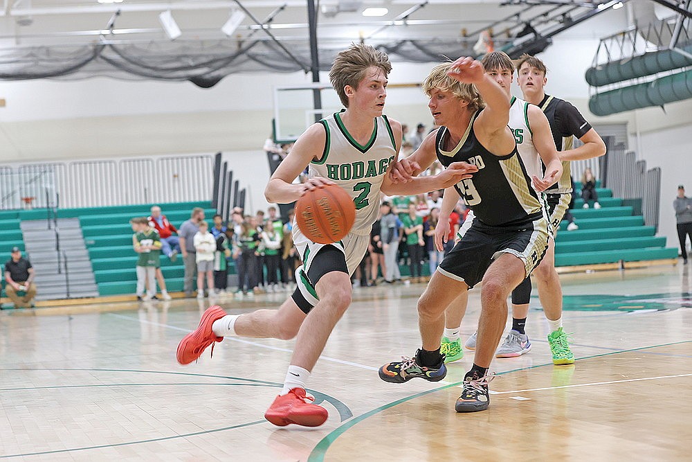 Rhinelander’s Devon Feck drives against Hayward’s Tyler Eaton during the second half of a WIAA Division 2 regional quarterfinal boys’ basketball game at the Jim Miazga Community Gymnasium Tuesday, Feb. 27. Feck scored a game-high 16 points as the Hodags defeated the Hurricanes 65-40 and advanced to tonight’s regional semifinal round at Rice Lake. (Bob Mainhardt for the River News)