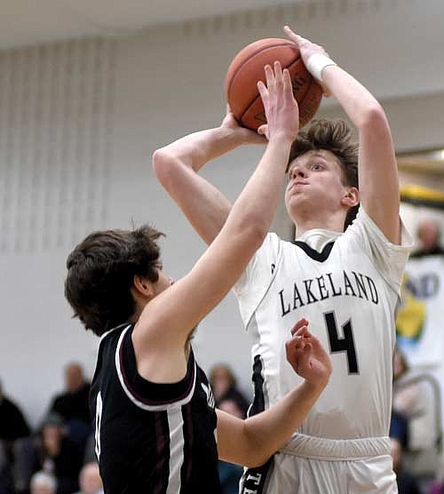 Hakken Berklund makes a jumper in the first half of a WIAA Division 2 regional quarterfinal game against Menomonie Tuesday, Feb. 27 at Ted Voigt Court in Minocqua. (Photo by Brett LaBore/Lakeland Times)
