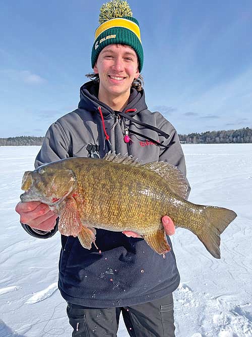 Hardwater Hodag Ryan Morien is show with a bass he caught while competing in the recent Wisconsin Interscholastic Ice Fishing Association (WIFA) state tournament. (Submitted photo)