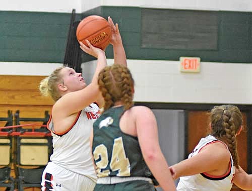 In this Nov. 14, 2023 file photo, Eiley Schoeneman takes a shot in the first half against Chequamegon at Chequamegon High School. Schoeneman led the Northern Lights Conference with 282 rebounds. (Photo by Brett LaBore/Lakeland Times)