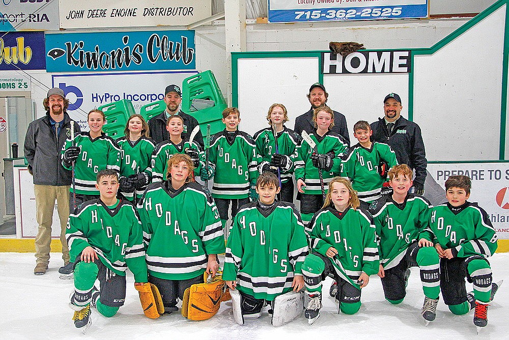 The Rhinelander Ice Association Peewee A hockey team poses for a photo after clinching a state berth during Region 2 playdowns at the Rhinelander Ice Arena Sunday, Feb. 4. Pictured in the front row, from left to right, are Gage Chavez, Connor McGee, Max Cahee, Hugh Anunson, Nick Schneider and Sawyer Peters. In the middle row are Lena Chiamulera, Liam Kennedy, Jacob Baumann, Wyatt Peters, Evan Rodziczak and Easton Ostrom. In the back row are coach Ryan Gartman, coach Jed Peters, head coach Randy Ostrom and coach Dan Cahee. The team will travel to Somerset this weekend for the WAHA Peewee 3A state tournament. (Jeremy Mayo/River News)