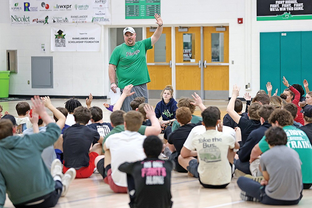 Rhinelander High School track coach Aaron Kraemer addresses his team during its first practice of the season in the Jim Miazga Community Gymnasium Monday, March 4. The Hodags had more than 90 athletes in attendance at practice Monday as participation numbers for the sport continue an upward trend. (Bob Mainhardt for the River News)