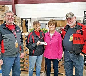 Pictured from left to right are Pastor Rod Ankrom of Calvary Baptist Church in Rhinelander, Ruby’s Pantry volunteer Carol Schumacher, Diane Syms of ACES, and  Ruby's Pantry volunteer Dan Roesler. (Submitted photo)
