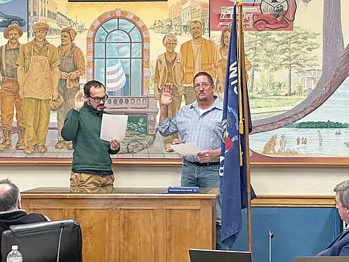 Rhinelander city clerk Austyn Zarda, left, administers the oath of office to new District 4 alderman Bob Lueder Monday, March 11, 2024 in the council chambers at City Hall. (Submitted photo)