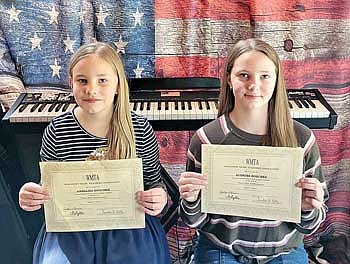 Annalisa and Audrina Boschke hold their certificates of achievement for their solo piano performance at the WMTA district audition. Not pictured: Aden Perron. (Contributed photograph)