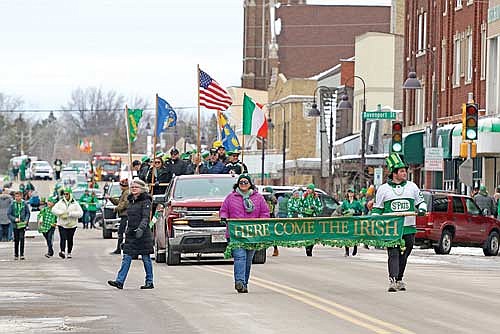 In this River News file photo, participants march in the annual St. Patrick’s Day Parade in downtown Rhinelander. This year’s parade will take place at 1:30 p.m. Saturday, March 16. (River News File Photo)