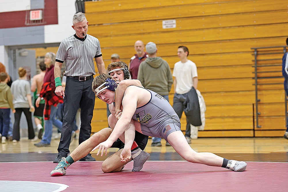 In this Feb. 3, 2024 file photo, Rhinelander’s Logan Schwinger attempts to put Tomahawk’s Blake Younker in a headlock during the GNC wrestling tournament in Antigo. Schwinger was one of three individual conference champions for the Hodags this winter in wrestling, joining Owen Kurtz and Reid Schultz. (Bob Mainhardt for the River News)