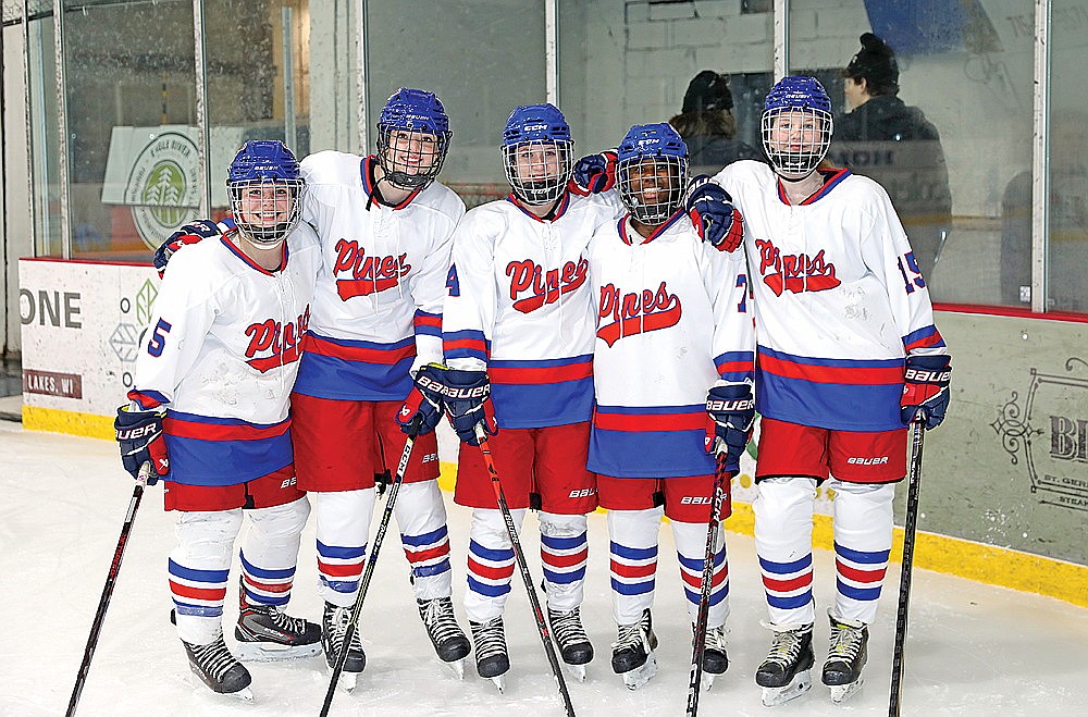 In this Jan. 7, 2024 file photo, Rhinelander players on the Northland Pines girls’ hockey co-op pose for a photograph following a game against Medford at the Eagle River Sports Arena. Pictured, from left to right, are Reese Retallick, Maddie Legrey, Emalee Detienne, Mia Tulowitzky and Lily Pequet. Rhinelander goaltenders Jalyn Zadnik and Hannah Mueller were unavailable for the photograph. (Bob Mainhardt for the River News)