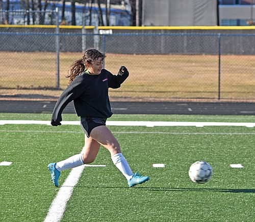 Laura Navarette takes a shot during the first week of practice Tuesday, March 19 at IncredibleBank Field in Minocqua. (Photo by Brett LaBore/Lakeland Times)