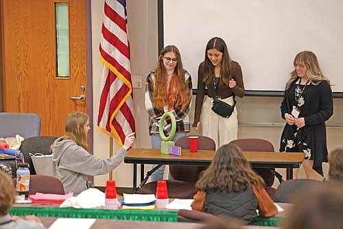Zoie Johnson, Tina Venden, Naomie Roberts and Breleigh Robinson participate in a “Shark Tank” activity during the 2024 Mad Money simulation Tuesday, March 19 at Rhinelander High School. (Photo by Bob Mainhardt for the River News)