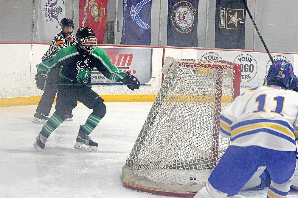 In this Jan. 16, 2024 file photo Rhinelander’s Joey Belanger scores a goal during the third period of a non-conference boys’ hockey game against Kingsford in Iron Mountain, Mich. The goal was Belanger’s 100th in his high school career as he became the first player in Rhinelander history to amass at least 100 goals and 200 total points. (Jeremy Mayo/River News)