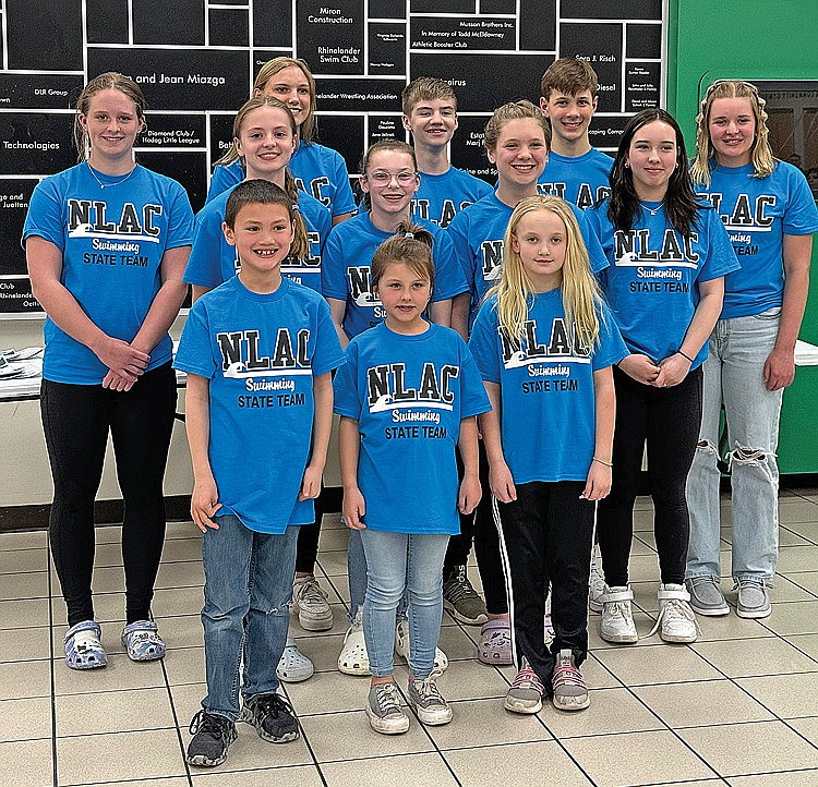 Rhinelander Swim Club swimmers who participated in age group Wisconsin state swim championships recently posed for a photograph in the Rhinelander High School commons. Pictured in the front row,  from left to right are Logan Lorenz, Brynn Laska and Madeline Then. In the second row are Charlotte LeClair, Stella Beach, Aubree Edwardson and Samantha Sherwood. In the back row are Rylee Mickevicius, Ella Heck, Kaleb Lehmann, Dean Gillingham and Emma Houg. State qualifiers Zacha King, Dolan O’Malley and Judson O’Malley were unavailable for the photograph. (Submitted photo)