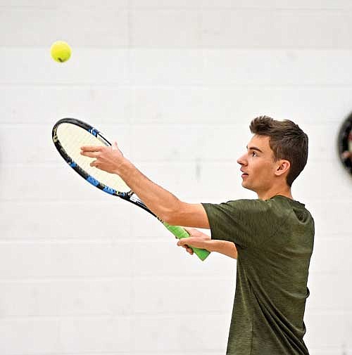 Tyler Wallace practices his serve during the first day of practice Wednesday, March 27 at the Lakeland Union High School fieldhouse in Minocqua. (Photo by Brett LaBore/Lakeland Times)