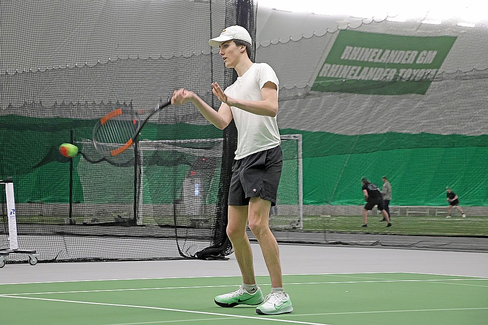 Rhinelander’s Dalton Fritz plays a point during Rhinelander High School boys’ tennis practice in the Hodag Dome Monday, March 25. Fritz, last year’s Great Northern Conference champion at No. 1 singles, is likely to move to doubles this year to pair with senior Joey Belanger. (Jeremy Mayo/River News)