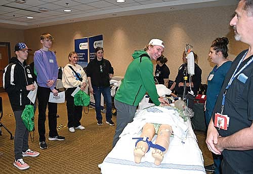 Rhinelander senior Owen Kurtz practices CPR on an Aspirus Rhinelander Hospital Emergency Department mannequin. (Photo courtesy of Matt Thompson/Aspirus Health)