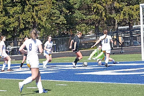 Avery McKinney scores her second goal of the game in the first half of a 5-0 win over Kingsford, Mich. Saturday, April 6 at Ted Fritsch Field in Green Bay. McKinney scored a hat trick in the game, her first career varsity goals. (Photo by Brett LaBore/Lakeland Times)