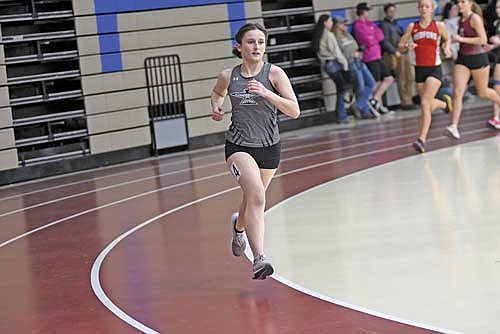 Ada Ernst runs to a second-place finish in the 1,600-meter run during the Northland Pines Indoor Meet Thursday, April 4 at Northland Pines High School in Eagle River. Ernst ran a time of 6:06.23. (Photo by Brett LaBore/Lakeland Times)