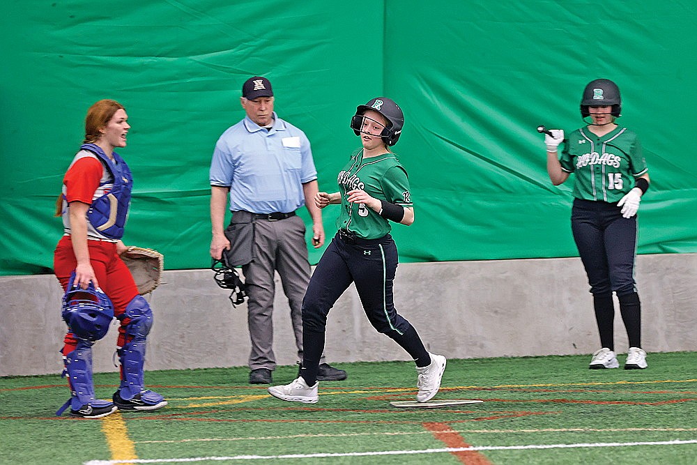 Rhinelander’s Cassidy Lindner crosses home plate and scores following a throwing error in the first inning of a GNC softball game against Northland Pines in the Hodag Dome Thursday, April 4. The Hodags defeated the Eagles, 14-6, earning their first win of the season. (Bob Mainhardt for the River News)