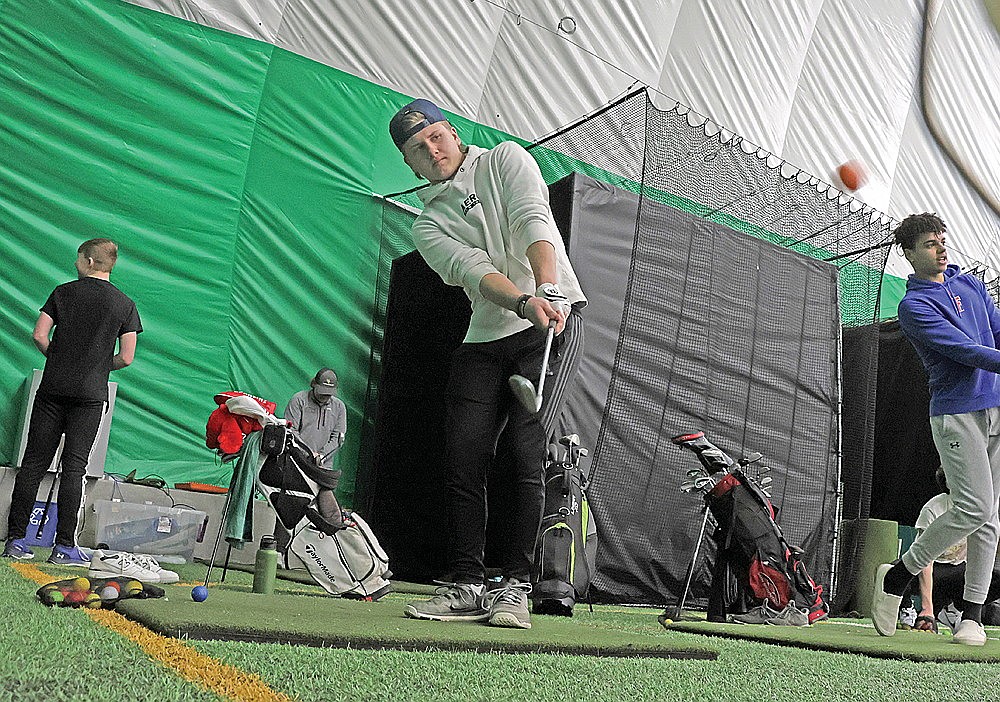 Sam Schoppe works on chipping in the Hodag Dome during a Rhinelander High School golf team practice in the Hodag Dome Monday, March 25. Schoppe, a junior, is back for the Hodags after qualifying for the WIAA Division 1 state golf tournament last spring. (Jeremy Mayo/River News)