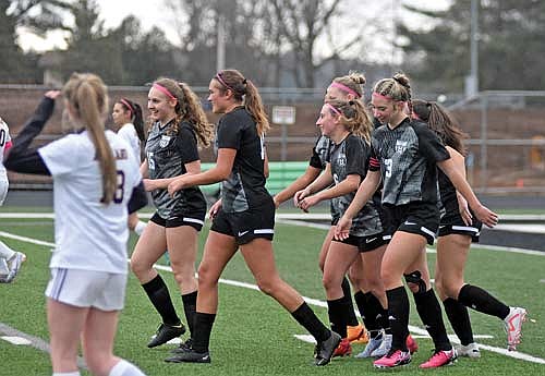 Soccer players, from left, Jenna Klappa, Charley Cleveland, Taylor Heleniak (6) and Josie Wentland (23) celebrate Heleniak’s game-tying goal in the first half against Ashland Monday, April 8 at IncredibleBank Field in Minocqua. (Photo by Brett LaBore/Lakeland Times)