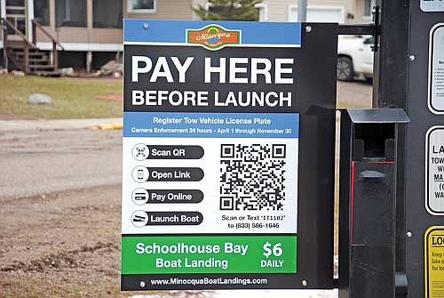 The new sign with the quick response (QR) code at Minocqua’s Schoolhouse Bay boat landing was installed on Friday, April 5. Starting this spring, boaters launching from the public Schoolhouse Bay, Thoroughfare Road and Cedar Street landings as well as the public landing next to the Thirsty Whale will be able to pay their launch fees online by scanning the code. (Photo by Brian Jopek/Lakeland Times)