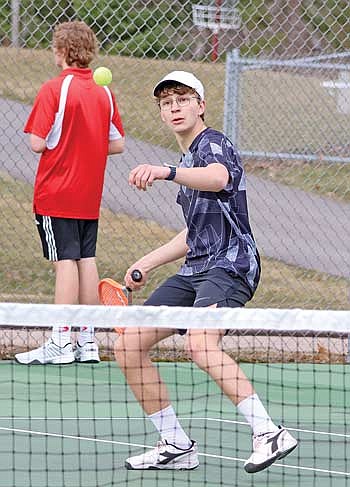 Mika Rempp stays focused on the ball during his No. 3 singles match in a conference-opening victory over Medford Tuesday, April 9 at Medford Area Senior High School. Rempp found victory at 6-2, 6-2 in his varsity debut. (Photo by Matt Frey/Star News)