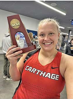 Aubrey Schoeneman celebrates her fourth-place finish in the shot put at the NCAA Division III Indoor Track and Field Championships March 9 at Virginia Beach Sports Center. Schoeneman threw the shot put 14.37 meters for All-American status. (Contributed photograph)