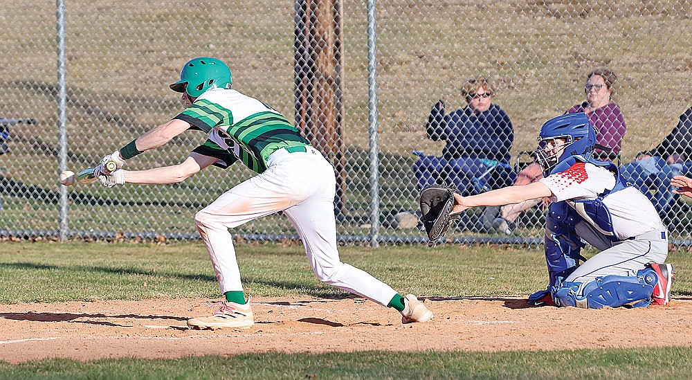 Rhinelander’s Seth Nofftz bunts for a base hit during the fifth inning of a GNC baseball game against Northland Pines at Stafford Field Monday, April 15. The Hodags had three bunt singles during a four-run fifth inning but it was not enough as Rhinelander fell to Northland Pines in eight innings, 8-5. (Bob Mainhardt for the River News)