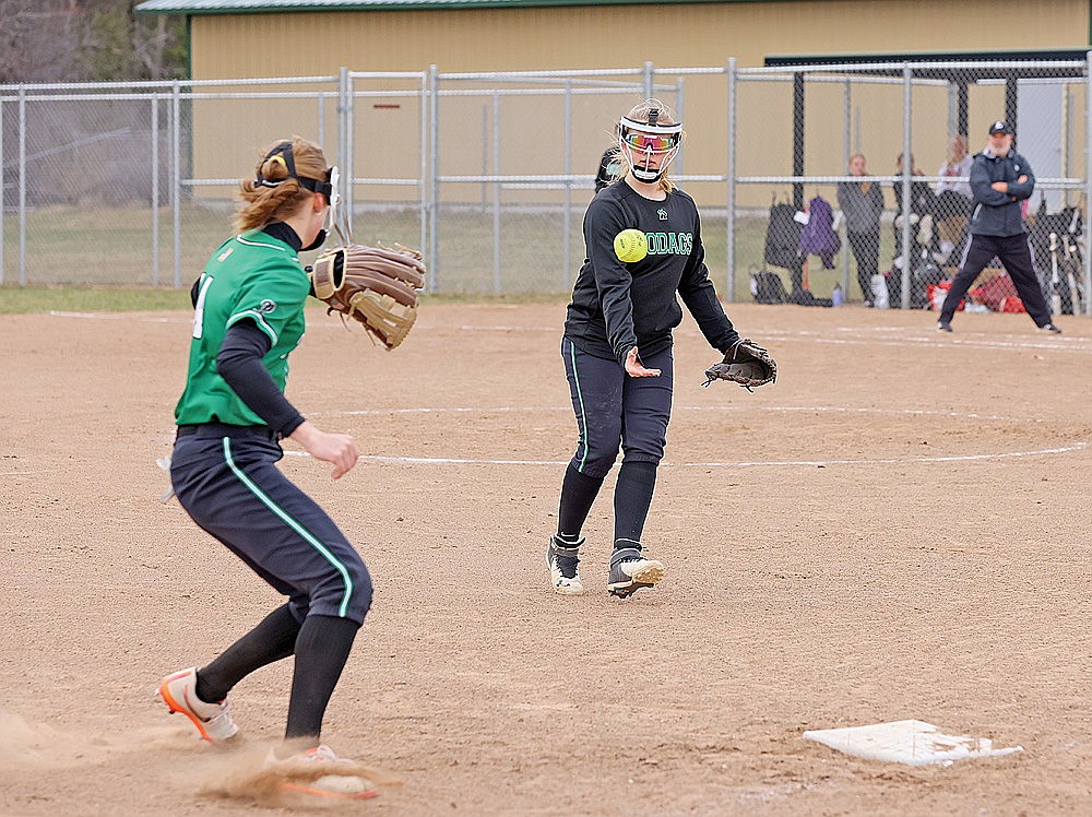 Rhinelander’s Lucy Lindner flips the ball to teammate Lily Treder for a force out at third base during the first inning of a GNC softball game against Lakeland at Andrea Musson Field Tuesday, April 16. (Bob Mainhardt for the River News)