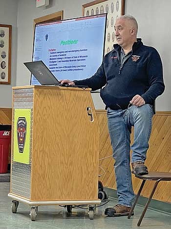 Mike Sipin with the Arbor Vitae fire and rescue department goes over items on a Powerpoint presentation intended for prospective department recruits on Thursday, April 11. (Photo by Brian Jopek/Lakeland Times)