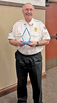 Don Kort of Minocqua holds his Charles B. Conway Lifetime Achievement Award he received at the Wisconsin State Firefighters Association banquet and awards presentation in Stevens Point on March 23. (Contributed photographs)