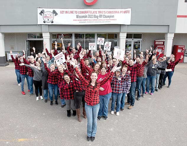 Christina Powers of Trig’s Tomahawk poses for a picture in front of the store with the Trig’s team behind her as a congratulations on her state bag off victory and ahead of the rally leading up to the national competition. (Contributed photo)