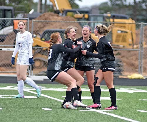 Players, from left, Landry Lenz, Jenna Klappa, Molly Jorgensen and Josie Wentland celebrate Jorgensen’s goal in the second half against Northland Pines Tuesday, April 23 at IncredibleBank Field in Minocqua. It was Jorgensen’s first-career varsity goal. (Photo by Brett LaBore/Lakeland Times)