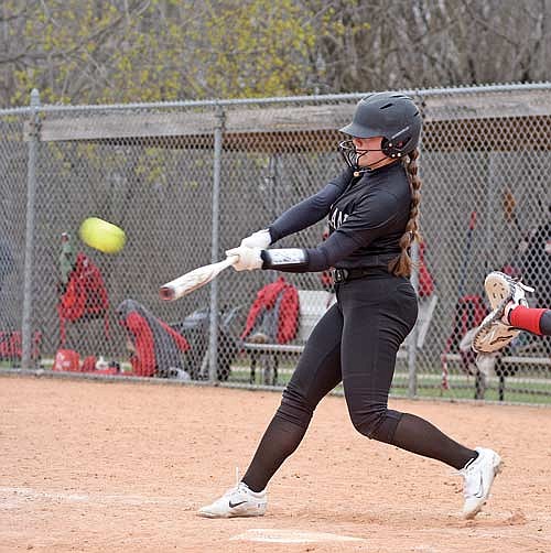 Karlin Williams lines a two-run double to center in the third inning against Kimberly Saturday, April 20 at Sunset Point Park in Kimberly. (Photo by Brett LaBore/Lakeland Times)