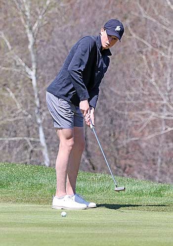 Gray Wagner putts the ball at the fifth hole of the Medford Invite Thursday, April 25 at Black River Golf Course in Medford. The Thunderbirds won the event with a score of 313. (Photo by Matt Frey/Star News)