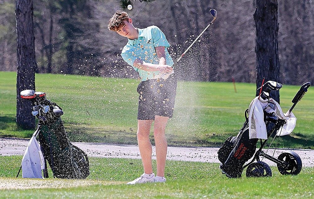 Rhinelander’s Blake Petroff splashes out of the sand on the par-5 fifth hole at Black River Golf Course in Medford during the Medford Invite Thursday, April 25. Petroff shot 87 Thursday and then shot 80 on Friday in a return trip to Medford has he took seventh in the second leg of the GNC golf tournament. (Matt Frey/Star News)