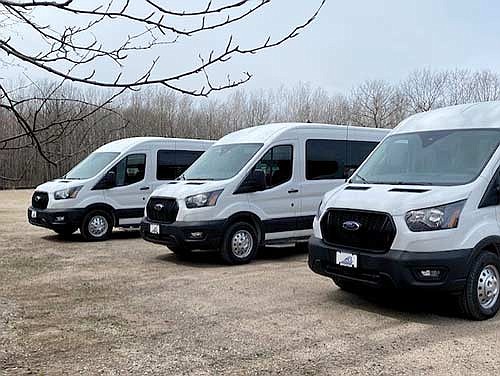 The three brand new seven-passenger Ford Transit vans purchased by the Oneida Vilas Transit Commission. Each van is equipped to handle two wheelchairs. (Contributed photograph)