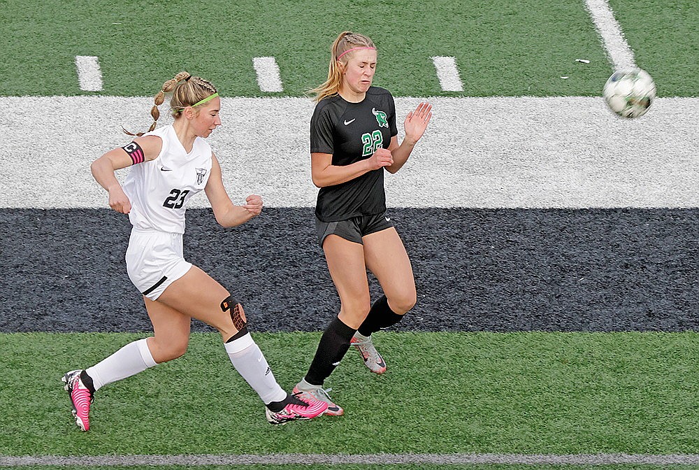 Lakeland’s Josie Wentland sends a ball past Rhinelander’s Vivian Lamers during the first half of a GNC girls’ soccer game at Mike Webster Stadium Tuesday, April 30. Wentland scored the lone goal of the game, a penalty kick in the eighth minute, as Lakeland defeated Rhinelander, 1-0. (Jeremy Mayo/River News)