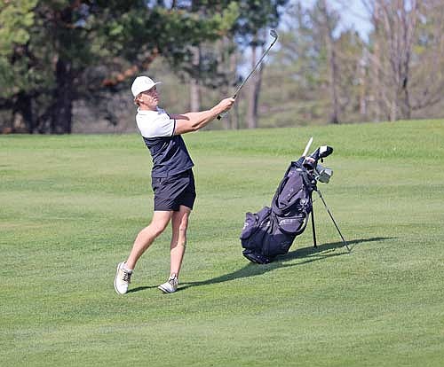 Jack Rubo hits his second shot on the seventh hole during GNC Meet No. 3 Monday, May 6 at Rhinelander Country Club. Rubo led the individual leaderboard with a 75. He also tied a school record with a 66 Saturday, May 4 at Big Fish Golf Club in Hayward. (Photo by Bob Mainhardt for the River News)