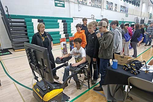 Students were able to simulate operating Ponsse equipment. Rhinelander is home to the North American headquarters of the Finnish company which develops timber harvesting equipment. (Photo by Bob Mainhardt/River News)