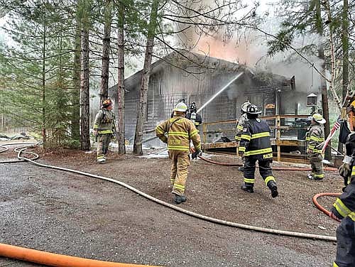 Firefighters from six different local departments responded to a structure fire on River Road in the Town of Pine Lake Tuesday evening. The structure, which was divided into two small apartments, is a total loss. (Pine Lake Fire Rescue/Facebook)