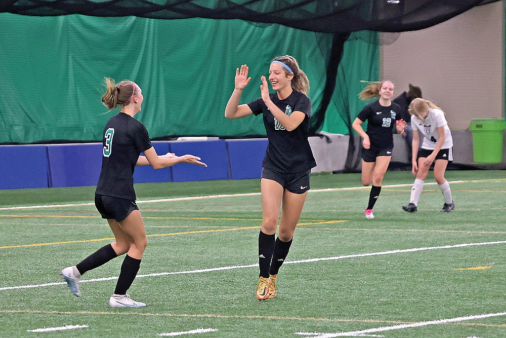 Rhinelander’s Lindsey Hoerchler celebrates with teammate Morgan Van Zile (3) after scoring a goal during the first half of a GNC girls’ soccer game against Mosinee at the Hodag Dome Tuesday, May 7. The Hodags defeated the Indians, 7-0. (Bob Mainhardt for the River News)