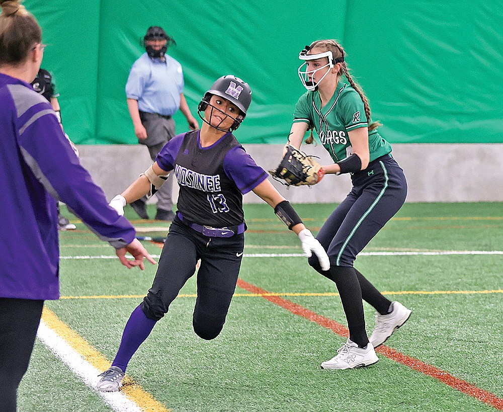 Mosinee’s Amber Gonzalez attempts to elude the tag of Rhinelander’s Nora Rutkowski on a ground ball to first during the first inning of a GNC softball game at the Hodag Dome Tuesday, May. 7. (Bob Mainhardt for the River News)