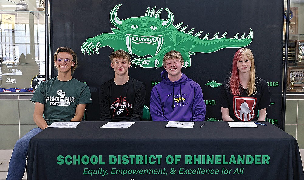 Four Rhinelander High School seniors declared collegiate athletic intentions during a signing day ceremony in the RHS commons Monday, May 13. Pictured, from left to right are Zacha King (men’s swimming, Green Bay), Will Gretzinger (men’s basketball, Edgewood College), Landon Bates (football, UW-Stevens Point) and Abbie Ames (women’s swimming, Monmouth (Ill.) College). (Bob Mainhardt for the River News)