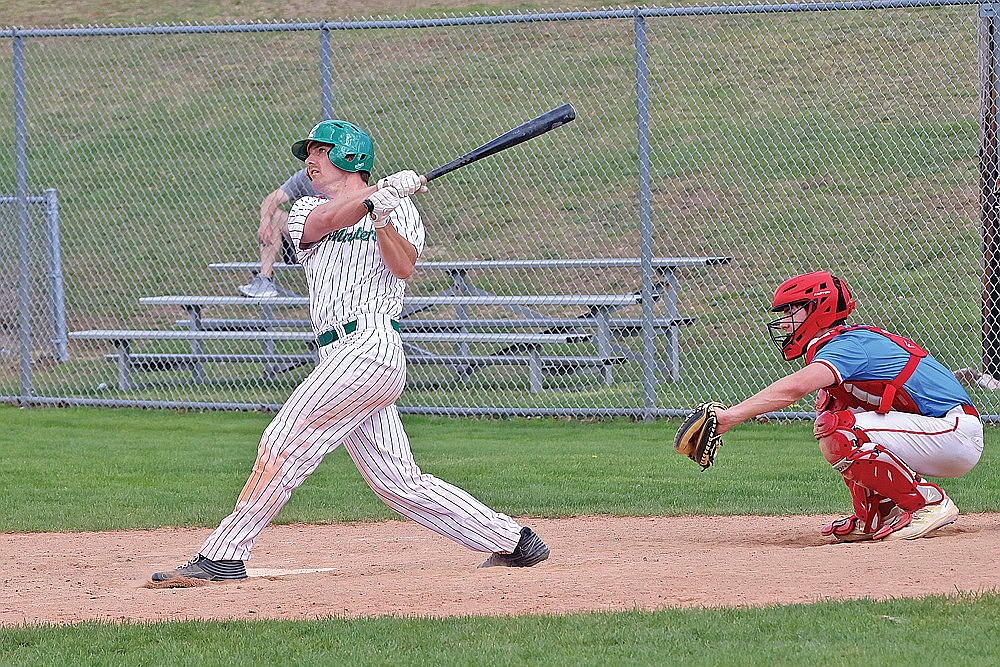 Rhinelander’s Tyler Blomdahl drives a ball to deep left field during the ninth inning of a Dairyland League baseball game against Wisconsin Rapids at Stafford Field Sunday, May 12. Blomdahl nearly hit a game-tying home run, but had to settle for an RBI double as the River Monsters fell to the Redhawks, 12-10. (Bob Mainhardt for the River News)