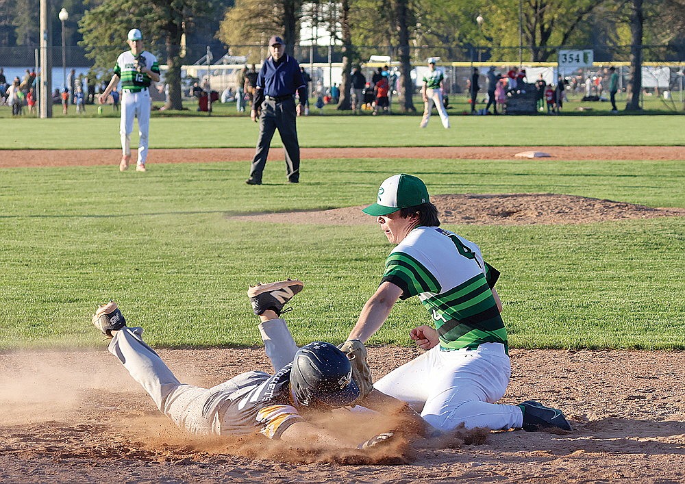 Rhinelander’s Kaden Vanney attempts to tag Tomahawk’s Drew Tollefson at the plate in the seventh inning of a GNC baseball game at Stafford Field Tuesday, May 14. Tollefson was ruled safe on the play and the Hodags gave up six runs to the Hatchets in the seventh inning as they fell to Tomahawk, 13-6. (Bob Mainhardt for the River News)