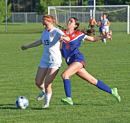 Landry Lenz possesses the ball before being fouled by Northland Pines’ Addison Paez in the second half of a 2-0 win Tuesday, May 14 at Sam Larsen Field in Eagle River. (Photo by Brett LaBore/Lakeland Times)