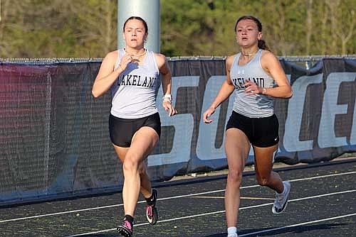 Stella Meza, left, and Kieran Petrie run side by side in the 400-meter dash during the Great Northern Conference Meet Tuesday, May 14 at Raider Field in Medford. Petrie finished third with a time of 1:01.21, a personal record, and Meza eighth with a time of 1:04.15. (Photo by Matt Frey/Star News)