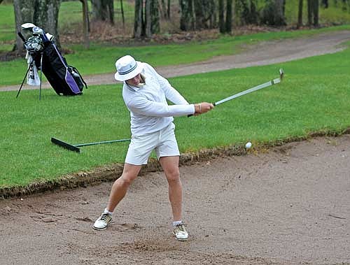 Jack Rubo chips the ball out of the bunker on the 15th hole during the seventh Great Northern Conference Meet Thursday, May 16 at Trout Lake Golf Club in Arbor Vitae. (Photo by Brett LaBore/Lakeland Times)